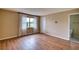 Neutral bedroom with wood floors, natural light, and an adjoining bathroom at 4102 Lakewood Ave, Bradenton, FL 34208