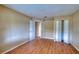Comfortable bedroom featuring wood-look floors, built-in shelving, and a bi-fold closet for ample storage at 4102 Lakewood Ave, Bradenton, FL 34208