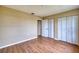 Neutral bedroom with wood floors and closet at 4102 Lakewood Ave, Bradenton, FL 34208