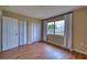Neutral bedroom featuring wood floors and a closet at 4102 Lakewood Ave, Bradenton, FL 34208