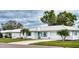 Charming single-story home with well-maintained landscaping and a pristine white exterior at 4102 Lakewood Ave, Bradenton, FL 34208