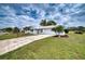 Charming single-story home with a well-manicured lawn, a driveway and a one-car garage at 4102 Lakewood Ave, Bradenton, FL 34208