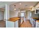 Open kitchen featuring an island with butcher block countertop, sink, and stainless steel appliances at 4102 Lakewood Ave, Bradenton, FL 34208