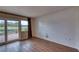 Cozy room with wood floors, a shiplap accent wall, and a sliding door that leads to the outdoors at 4102 Lakewood Ave, Bradenton, FL 34208