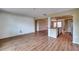 Bright living area featuring wood floors and a view into the kitchen, perfect for entertaining at 4102 Lakewood Ave, Bradenton, FL 34208