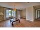 Bright living room with wood floors, neutral walls, and natural light at 4102 Lakewood Ave, Bradenton, FL 34208