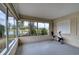 Enclosed patio area with lake views, large windows and exercise equipment at 4102 Lakewood Ave, Bradenton, FL 34208