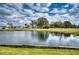 Enjoy this beautiful pond view with mature trees and lush greenery in a tranquil setting at 4102 Lakewood Ave, Bradenton, FL 34208