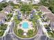 Aerial view of the community pool, surrounded by lush landscaping and parking areas at 4103 Foristall Ave # 4103, Sarasota, FL 34233