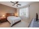 Comfortable bedroom featuring a ceiling fan, large window and neutral walls at 4103 Foristall Ave # 4103, Sarasota, FL 34233