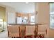 Kitchen bar with seating and a view of the kitchen appliances and countertop space at 4103 Foristall Ave # 4103, Sarasota, FL 34233