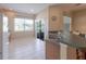Bright eat-in kitchen with stainless steel appliances, tile floor and view to the backyard pond at 4103 Foristall Ave # 4103, Sarasota, FL 34233
