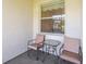 Relax on the patio with chairs and a table, perfect for enjoying the outdoors at 4103 Foristall Ave # 4103, Sarasota, FL 34233