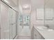Bathroom featuring single sink vanity, shower with glass door, and clean finishes at 4254 Vicenza Dr # B, Venice, FL 34293