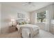 Cozy bedroom with a large bed, soft lighting, and neutral tones creating a relaxing atmosphere at 4254 Vicenza Dr # B, Venice, FL 34293