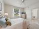 Bedroom boasts a view of the water with decor that creates a relaxing atmosphere at 4254 Vicenza Dr # B, Venice, FL 34293