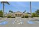 The clubhouse, has ample parking, mature palms, and manicured greenery at 4254 Vicenza Dr # B, Venice, FL 34293