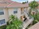 Exterior view of the building featuring two sets of stairs to the units at 4254 Vicenza Dr # B, Venice, FL 34293