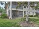 Back of the building features screened patios with water views at 4254 Vicenza Dr # B, Venice, FL 34293