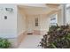 Welcoming front porch and door with glass window and neutral stucco walls provide a warm entrance at 4254 Vicenza Dr # B, Venice, FL 34293