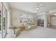 Bright living room with large window, a neutral color scheme and inviting decor at 4254 Vicenza Dr # B, Venice, FL 34293