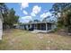 House backyard with a screened-in porch at 4405 Linwood St, Sarasota, FL 34232