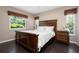 Bedroom with dark wood floors and furniture, and lots of natural light at 4405 Linwood St, Sarasota, FL 34232