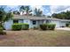 Charming single-story home with an attached two car garage and landscaped front yard at 4405 Linwood St, Sarasota, FL 34232