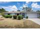 Charming single-story home with a well-manicured lawn and attached two car garage at 4405 Linwood St, Sarasota, FL 34232
