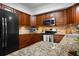 Updated kitchen with stainless steel appliances and granite countertops at 4405 Linwood St, Sarasota, FL 34232