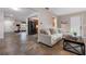 Inviting living room showcasing open layout, tile flooring, and seamless transition to the kitchen and exercise area at 4405 Linwood St, Sarasota, FL 34232