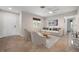Bright living room with neutral tones, modern furniture, and tile flooring at 4405 Linwood St, Sarasota, FL 34232