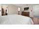 Cozy bedroom featuring hardwood floors, closet and dresser with television at 4405 Linwood St, Sarasota, FL 34232