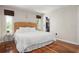 Bright main bedroom featuring hardwood floors, walk in closet, and large windows at 4405 Linwood St, Sarasota, FL 34232