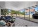 Comfortable screened in patio with outdoor furniture and view of backyard shed at 4405 Linwood St, Sarasota, FL 34232