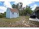 Backyard shed with a small pond at 4405 Linwood St, Sarasota, FL 34232