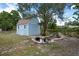 Backyard shed next to a small pond and water feature at 4405 Linwood St, Sarasota, FL 34232