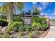 Attractive stone sign for Villa Amalfi community with lush landscaping at entrance at 4416 Amalfi Ave, Sarasota, FL 34243