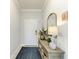 Bright foyer featuring a console table, decorative mirror, and neutral color palette at 4416 Amalfi Ave, Sarasota, FL 34243