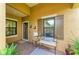 Inviting front porch with cozy seating, decorative shutters, and a charming exterior at 4416 Amalfi Ave, Sarasota, FL 34243