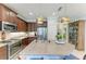 Kitchen boasts granite countertops, a large island, and stainless steel appliances at 4416 Amalfi Ave, Sarasota, FL 34243