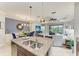 Kitchen with granite island and seating open to the living areas at 4416 Amalfi Ave, Sarasota, FL 34243