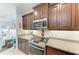 Gourmet kitchen with granite countertops, stainless steel appliances, and ample cabinet space at 4416 Amalfi Ave, Sarasota, FL 34243