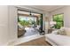 Relaxing screened-in lanai features comfortable seating, perfect for enjoying the outdoors at 4416 Amalfi Ave, Sarasota, FL 34243