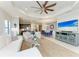 Bright, open-concept living room seamlessly connects to the kitchen and dining area, perfect for entertaining at 4416 Amalfi Ave, Sarasota, FL 34243