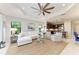 Spacious living room featuring large windows, comfortable seating, and an open layout at 4416 Amalfi Ave, Sarasota, FL 34243