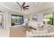 Bright living room with outdoor views through sliding glass doors to lanai at 4416 Amalfi Ave, Sarasota, FL 34243