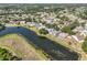 Aerial view of the neighborhood with homes and pond at 4627 56Th E Dr, Bradenton, FL 34203