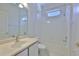 Bathroom with a shower over bath, good lighting, and a large mirror at 4627 56Th E Dr, Bradenton, FL 34203