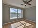 Light filled bedroom with a ceiling fan, wood floors, crown molding and a view of the screened in lanai and pool at 4627 56Th E Dr, Bradenton, FL 34203